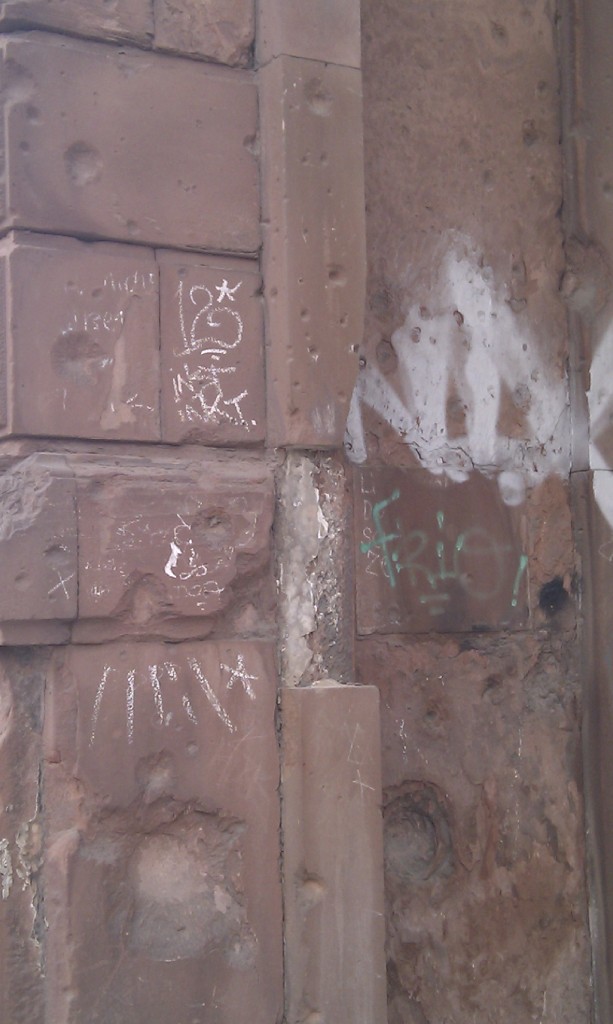 Remaining bullet holes in walls in East Berlin